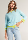 Light blue cashmere sweater with green contrast stripes