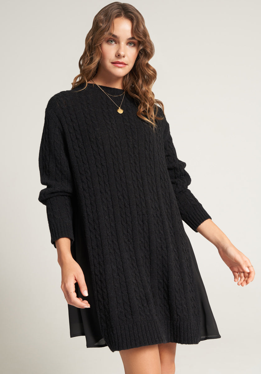 Short knitted dress with flowing insert on the back