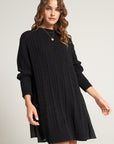 Short knitted dress with flowing insert on the back