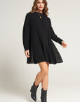 Short knitted dress with flowing insert on the back