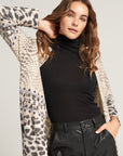 Long-sleeved shirt with turtleneck and heart decoration