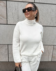 White sweater with decorative stand-up collar