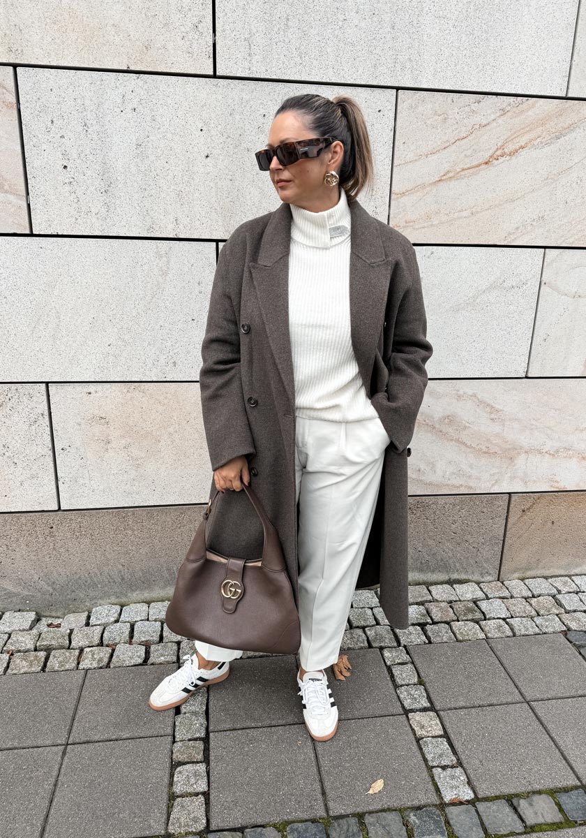 White sweater with decorative stand-up collar