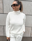 White sweater with decorative stand-up collar