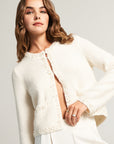 White cardigan with pearl decoration