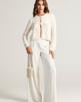 White cardigan with pearl decoration