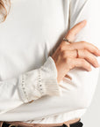 White long-sleeved shirt with cuff decoration