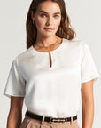 White silk blouse with button