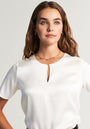 White silk blouse with button