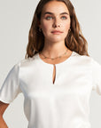 White silk blouse with button