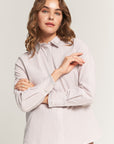 Beige striped shirt with decoration