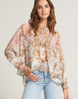 Silk blouse with ornamental print and ruffles