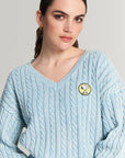 Snoopy V-neck sweater with cable pattern and wash