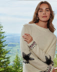 White jacquard sweater with star and decoration