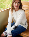 White jacquard sweater with star and decoration