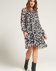 Pleated dress with bow and feather print