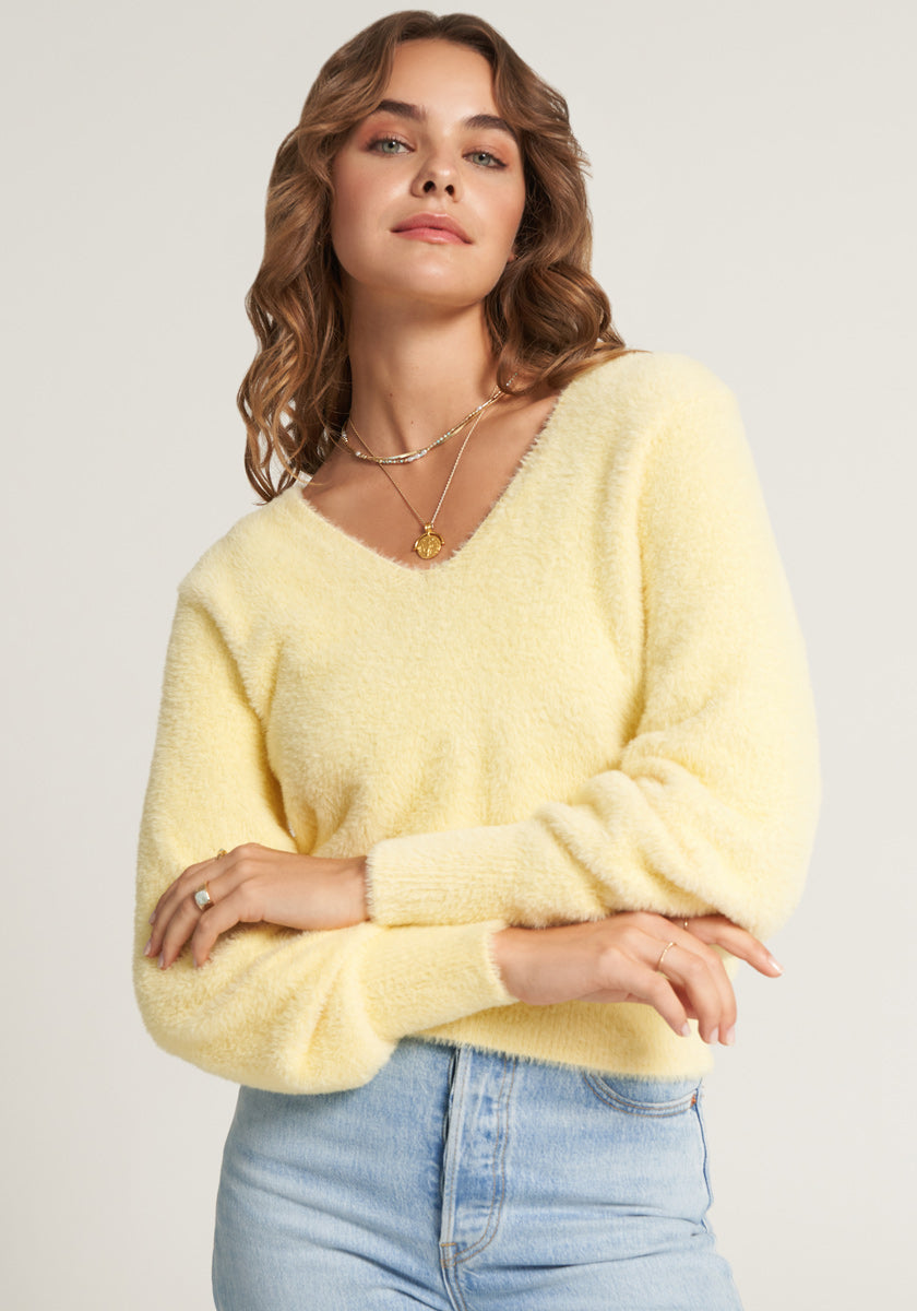 Yellow fluffy knitted sweater