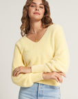 Yellow fluffy knitted sweater