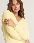 Yellow fluffy knitted sweater