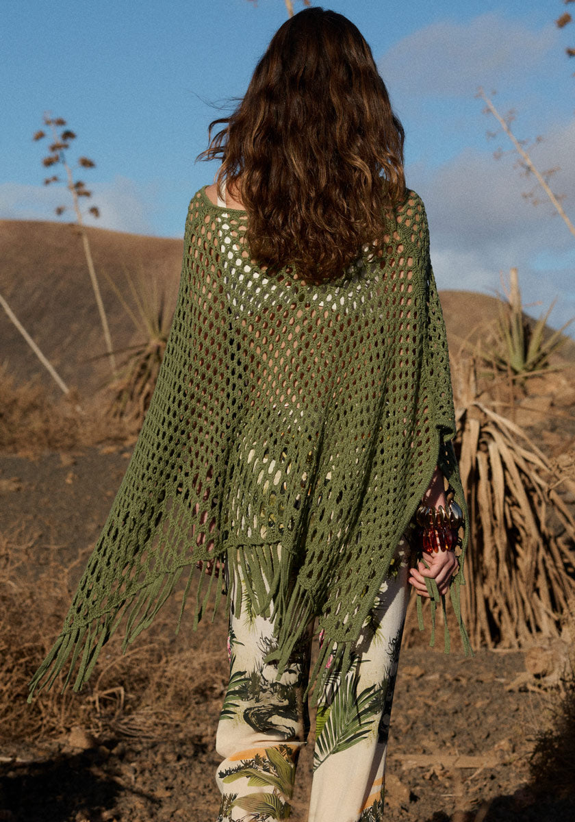 Poncho with net pattern and fringes