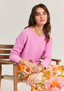 Pink fine knit sweater with rhinestone detail