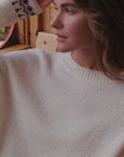 White jacquard sweater with star and decoration